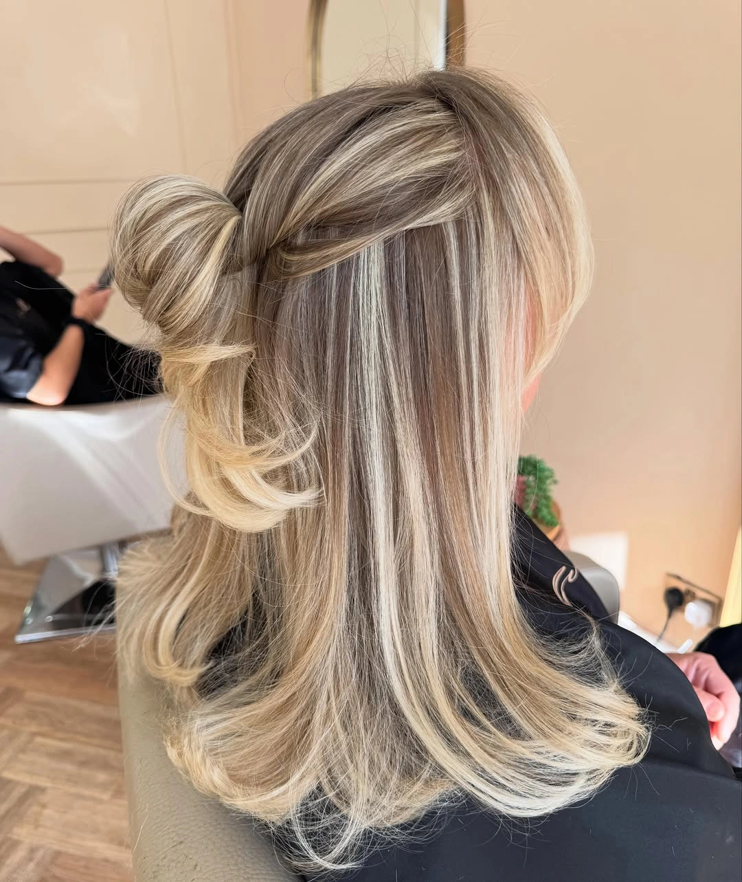 Half-up blonde hair with deeper ribbons and flipped ends