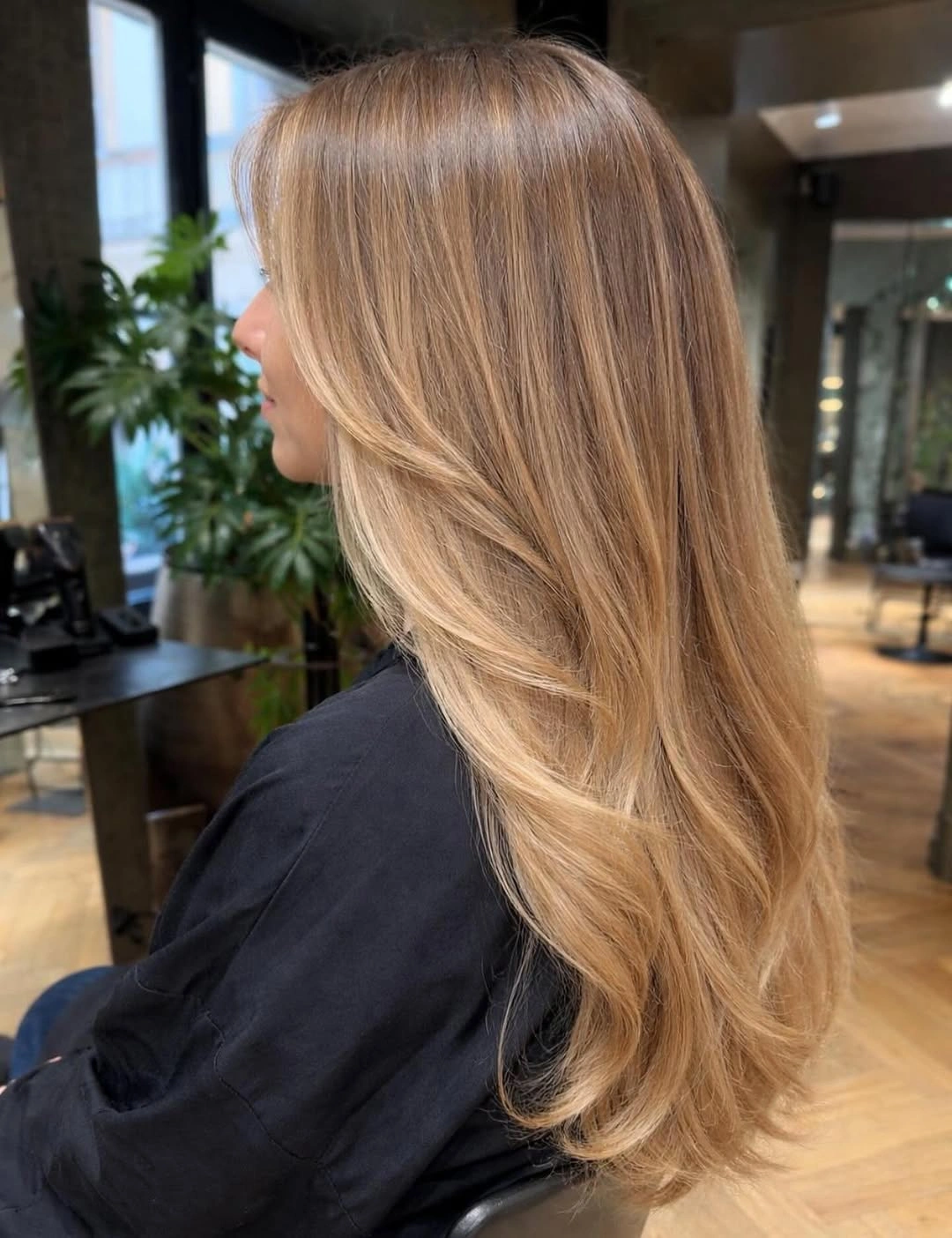 Long caramel-beige blonde hair with soft flowing layers