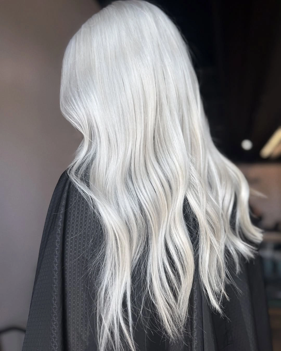 Long icy white blonde hair with loose back waves