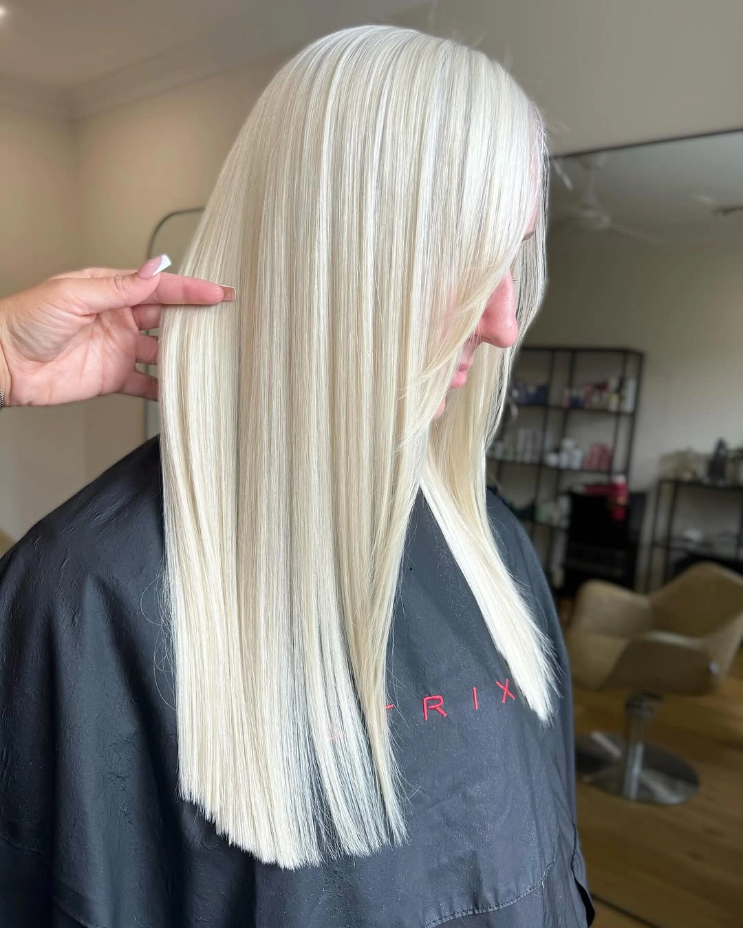 Very long straight platinum blonde hair with blunt lower edge
