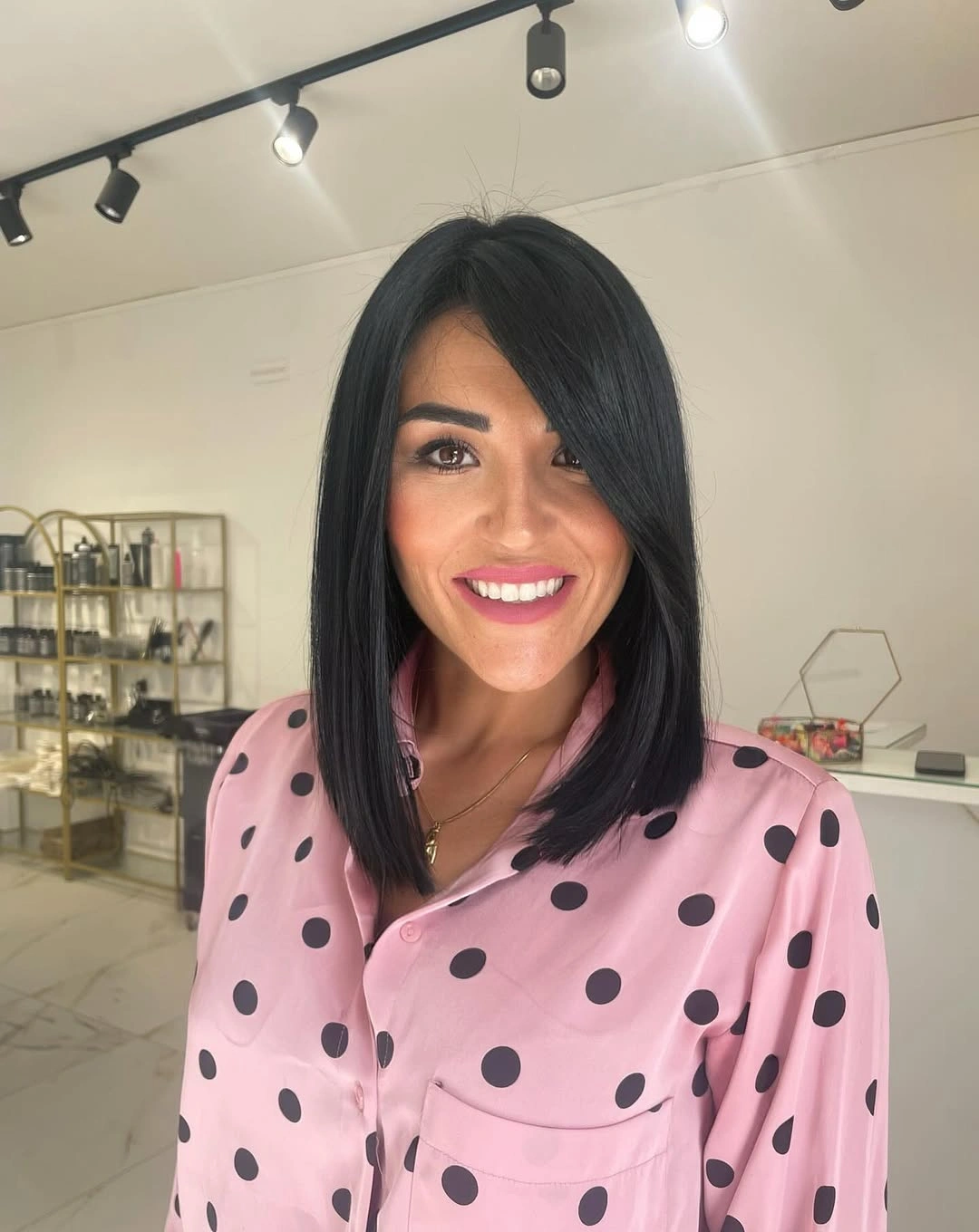 Short dark brunette hair with glossy side-swept front