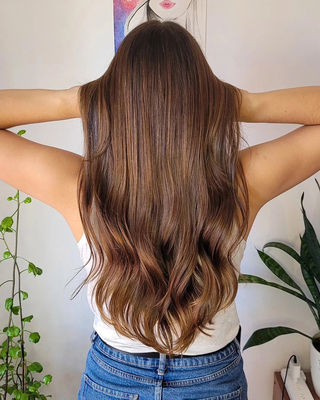 Long brunette hair with cinnamon-caramel ribbons and soft wavy ends