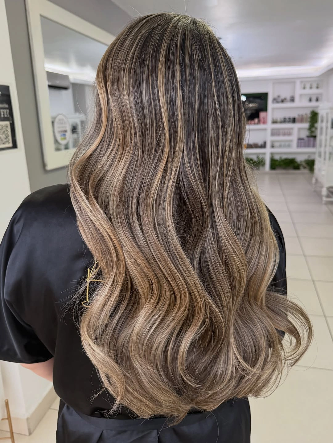Long brunette waves with beige ribbons and lighter curled ends