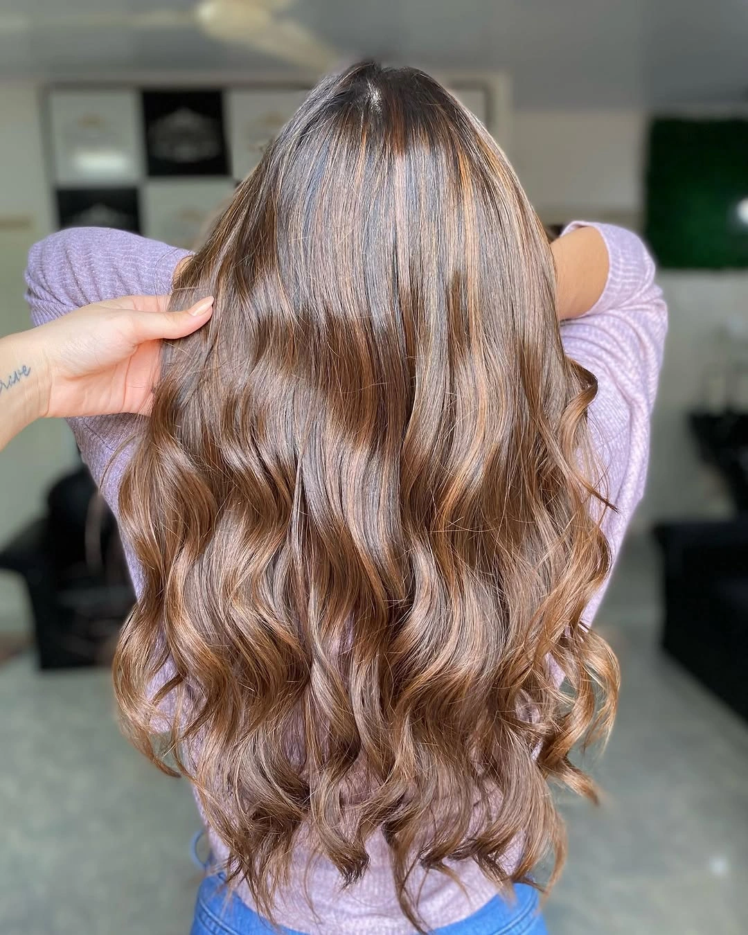 Long warm brunette waves with caramel-copper shine