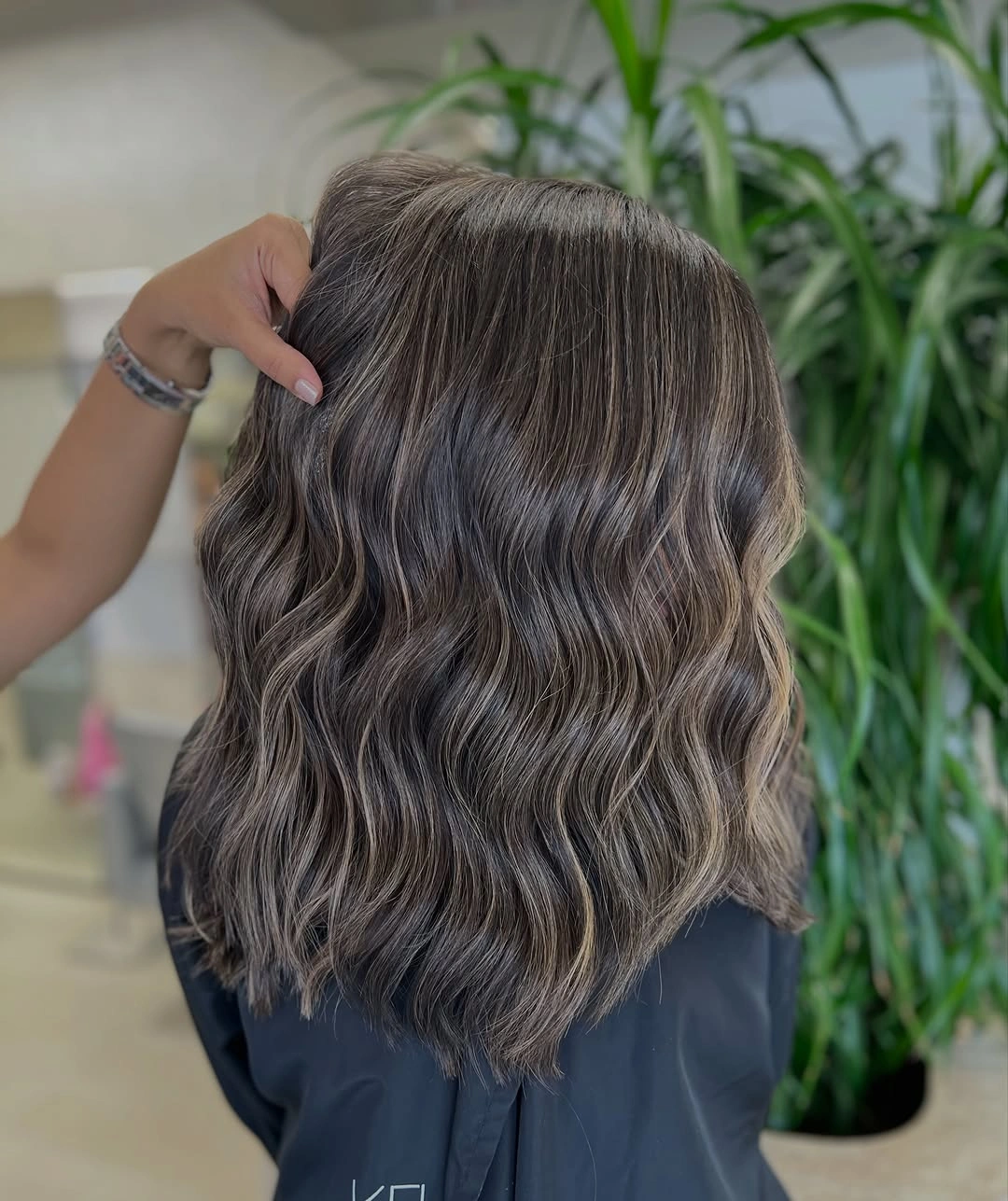 Medium wavy brunette hair with cool gray-beige ribbons