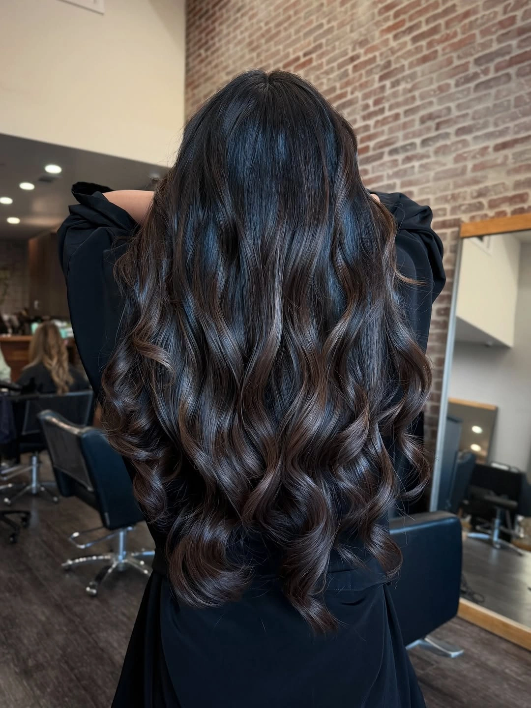 Very long dark brunette waves with subtle chocolate shine
