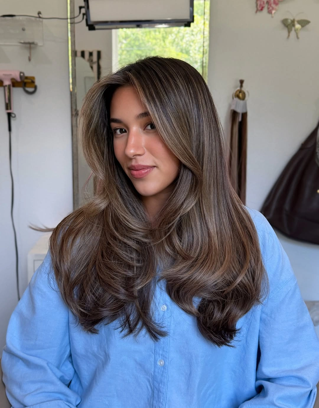 Long taupe brunette layers with soft light face-framing panels