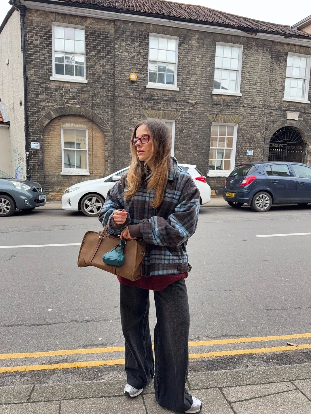 Gray blue plaid overshirt burgundy hem and white sneakers