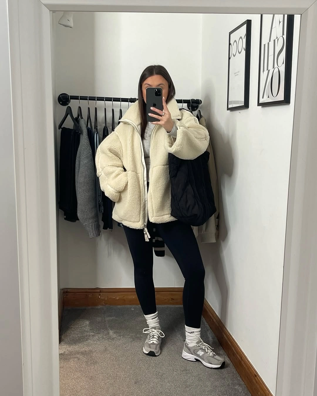 Cream fleece black leggings striped socks and gray sneakers