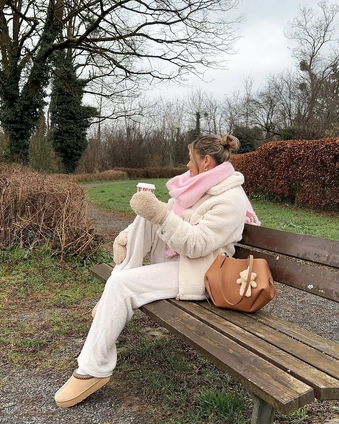 Cream teddy jacket trousers pink scarf mittens and tan boots