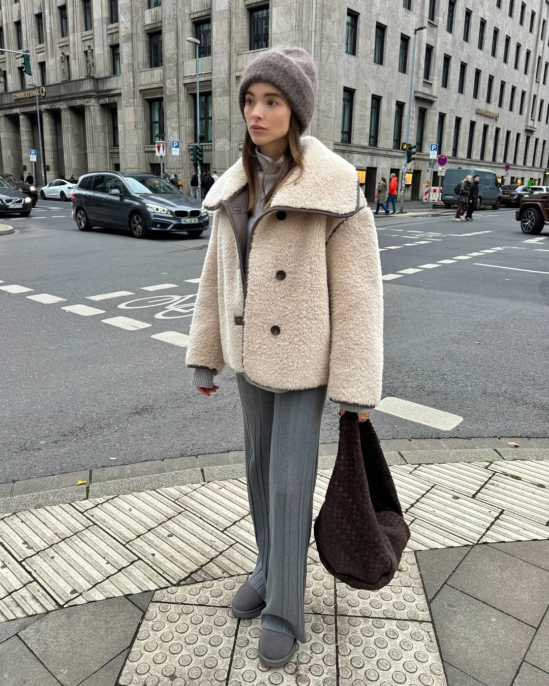 Waist-defined coat, coordinated boots, minimal bag, and tonal layers