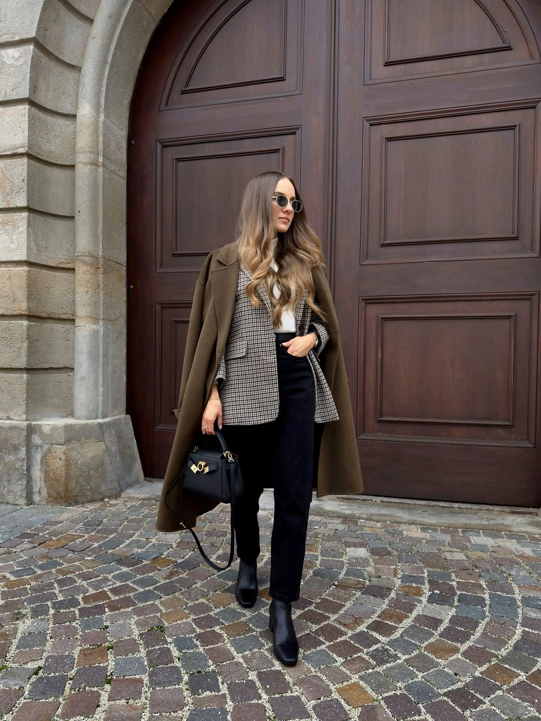 Toggle-front duffle coat, thick sweater, straight jeans, and practical boots