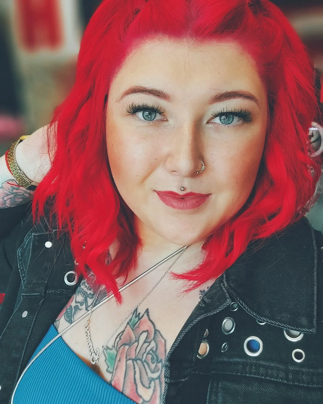 Vivid red shoulder-length waves with side part
