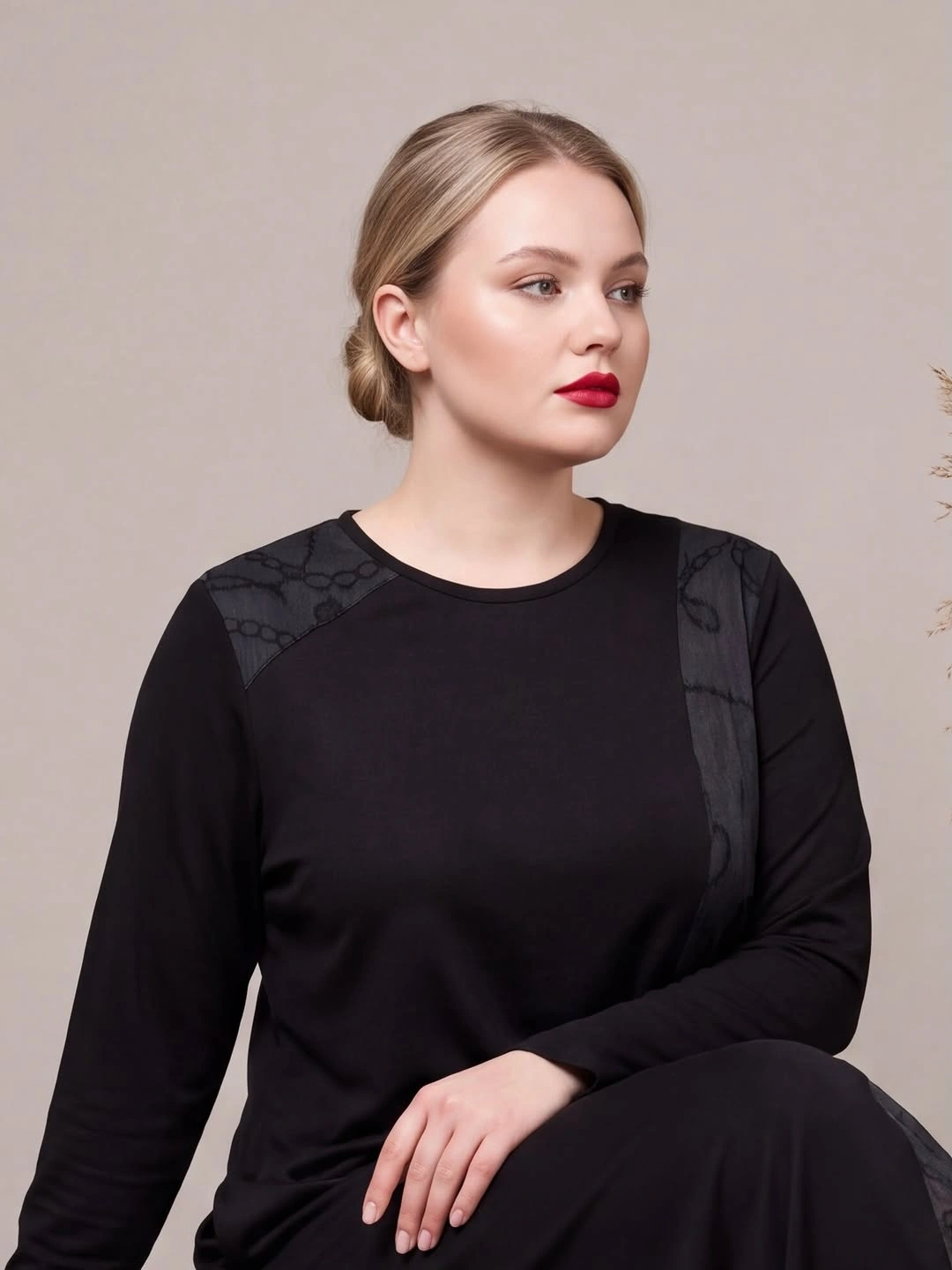 Sleek blonde center part styled into low bun