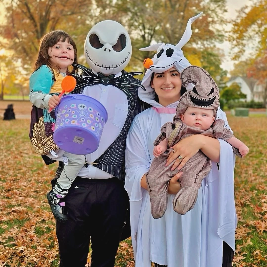 Striped skeleton character with pastel children costumes outdoors