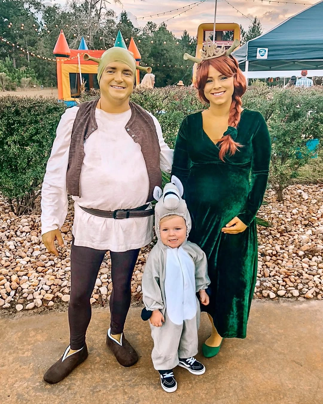 Family in storybook green brown and gray character costumes