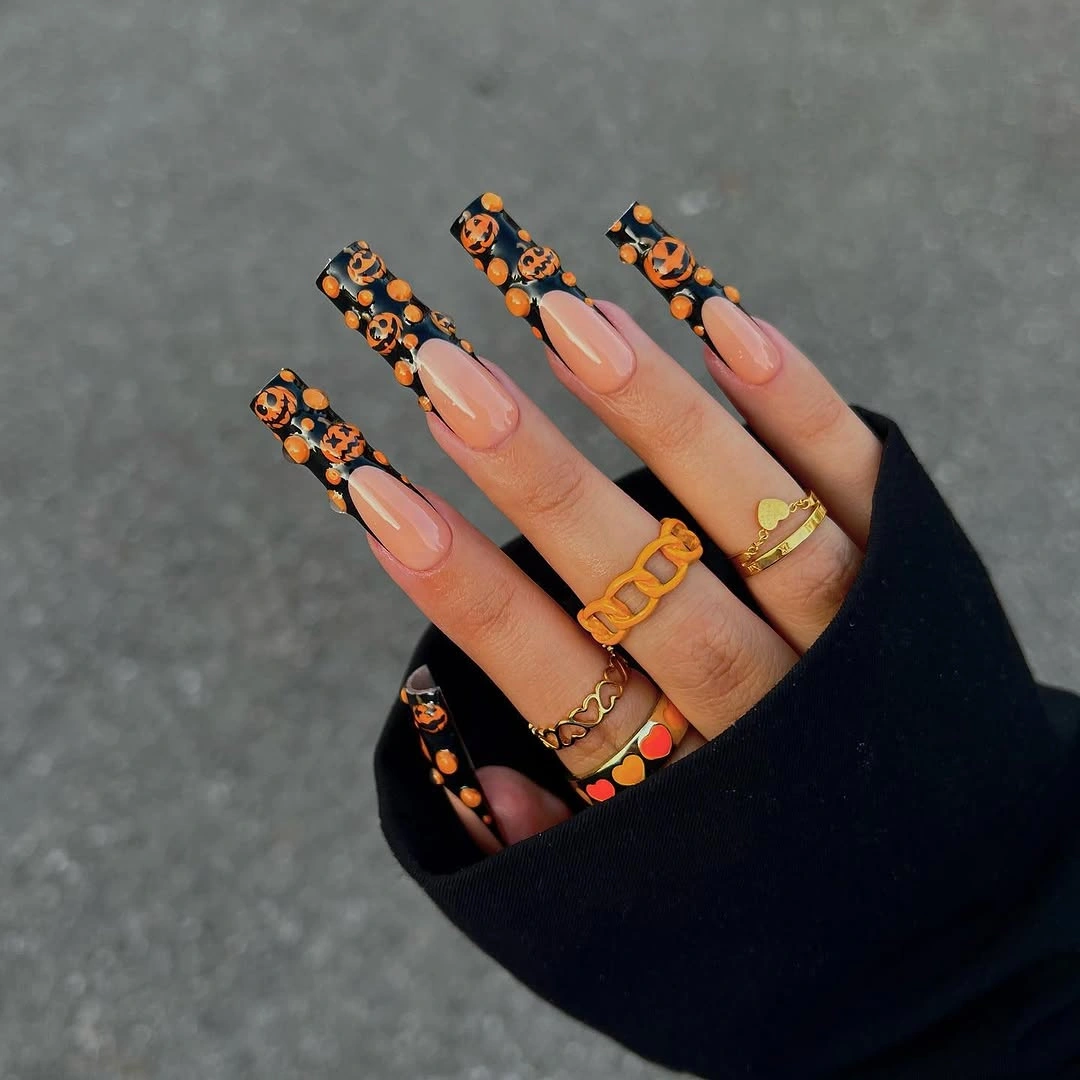 Long nude coffin nails with orange pumpkin French tips