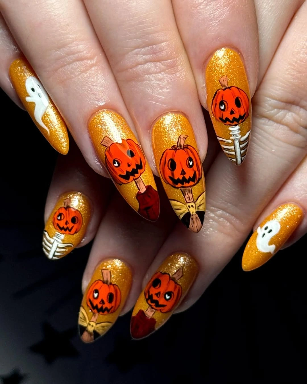 Medium Halloween nails with gold glitter pumpkins ghosts and skeleton detail
