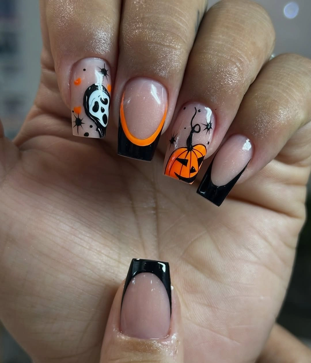 Nude square nails with black French tips pumpkins ghosts and webs