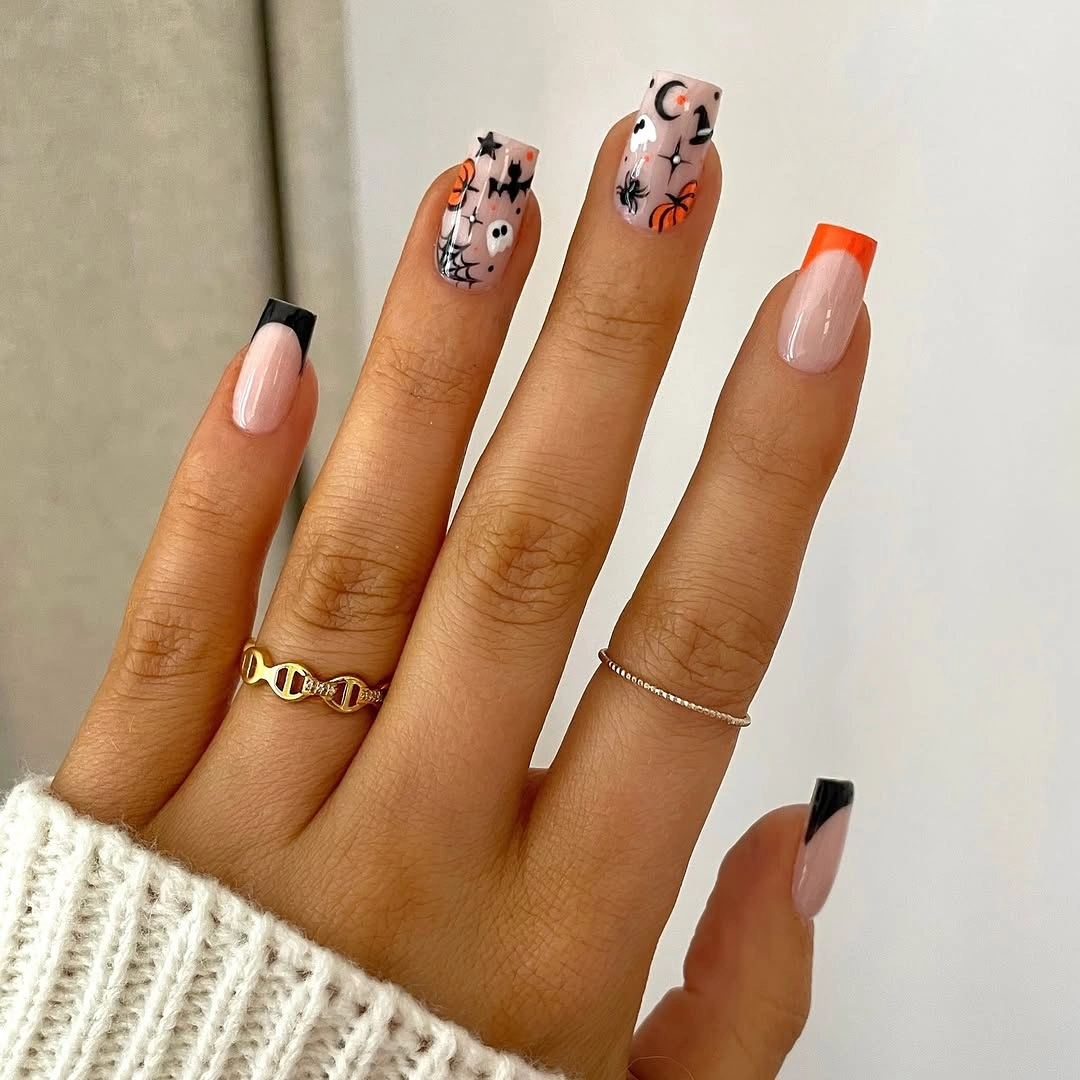 Long nude nails with black orange corner tips and ghost