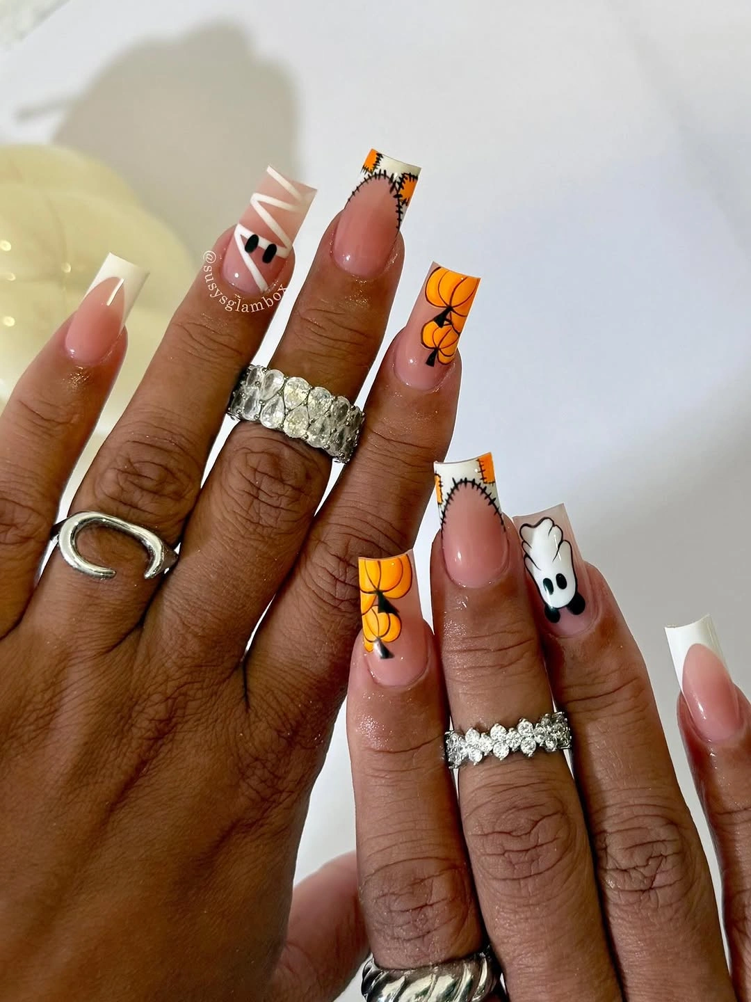 Long square nails with orange pumpkin tips ghost and web