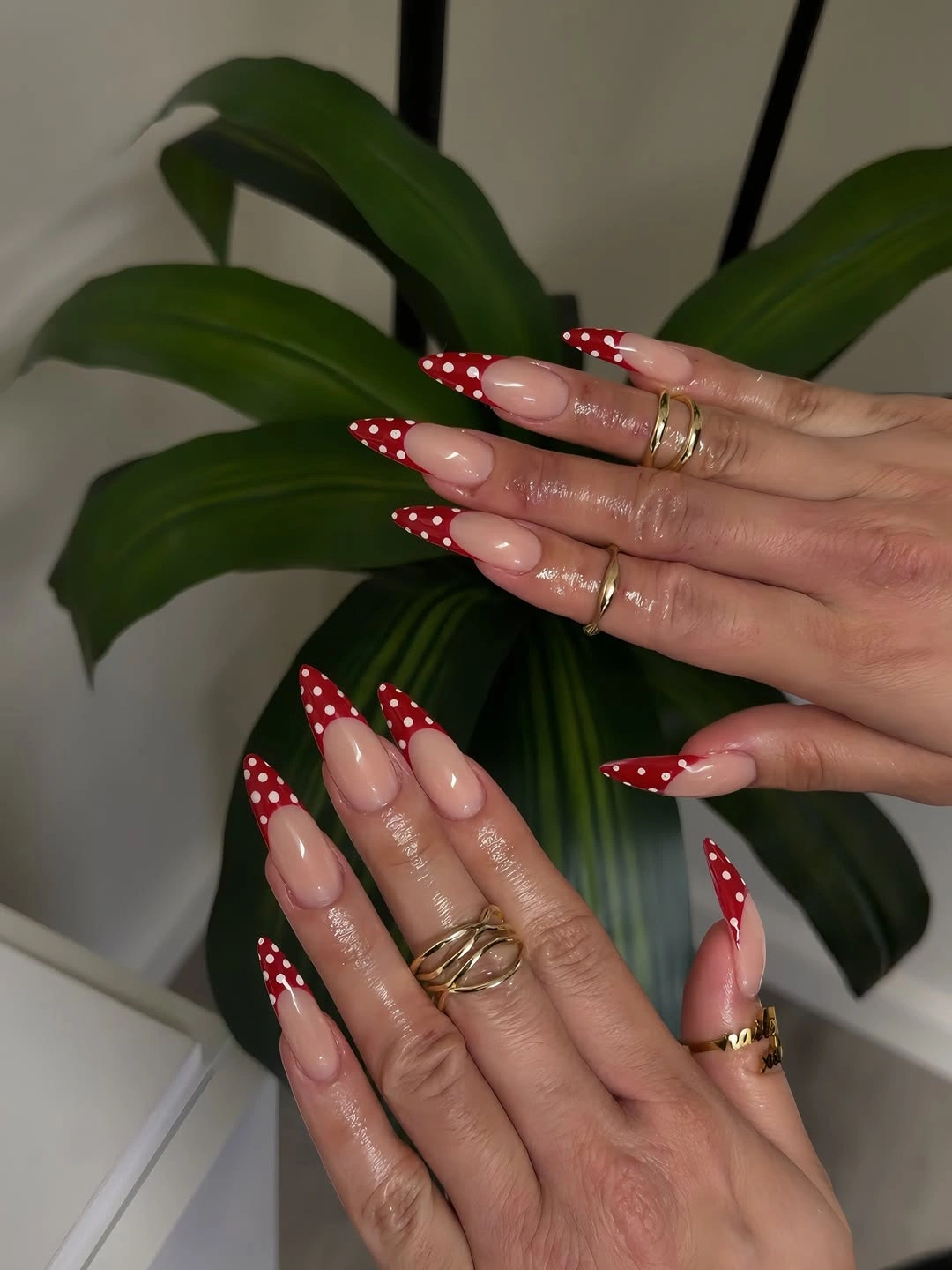 pointed nails with scarlet red tips and white polka dots