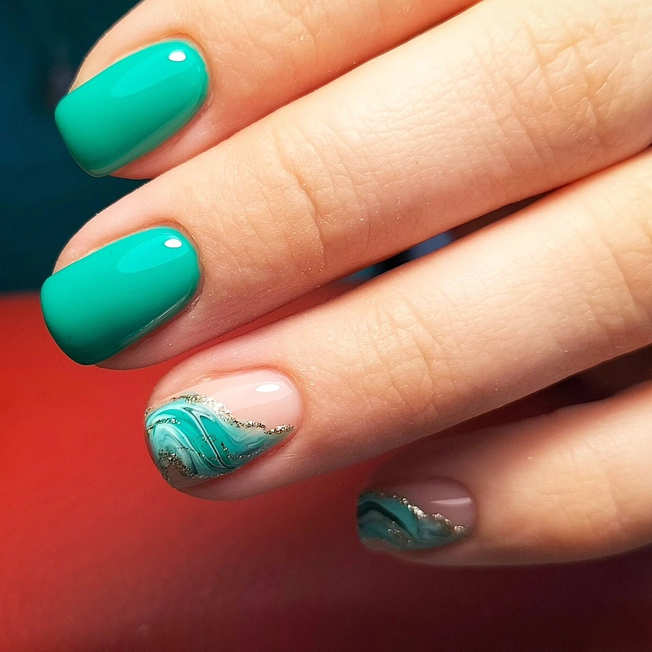 Glossy teal nails with nude marbled wave accents