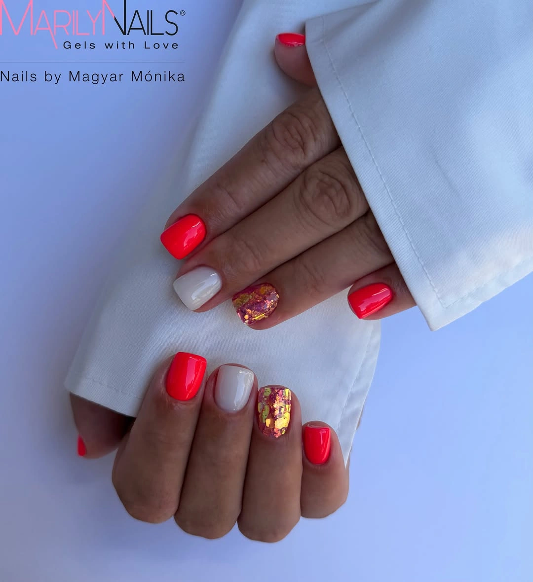 Short square nails with red coral, white and gold flakes