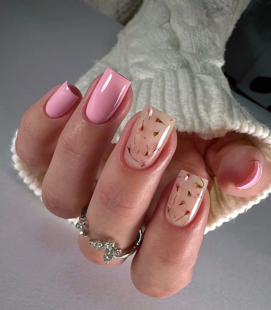 Pink squared nails with clear accents and foil-like flecks