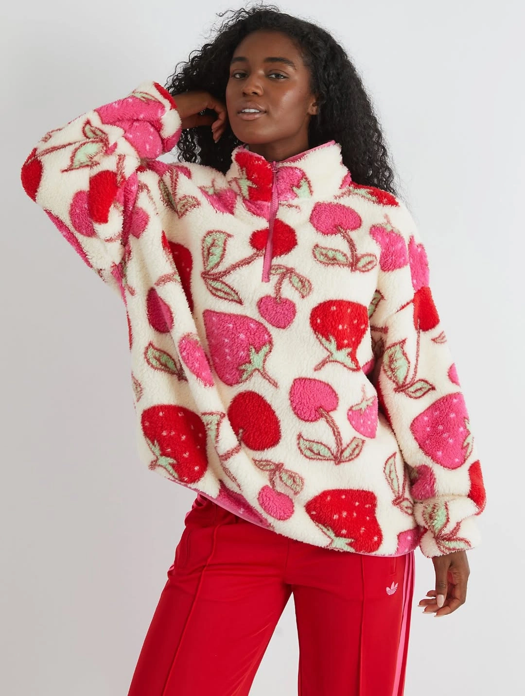 cream fruit-motif fleece with red track pants