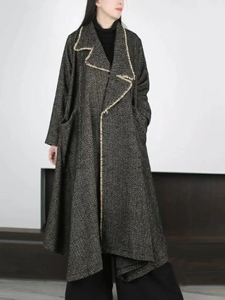 Dark long coat with pale edge detail and black layers