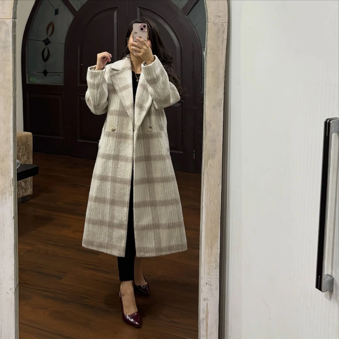 Long pale plaid coat with black pants and burgundy heels