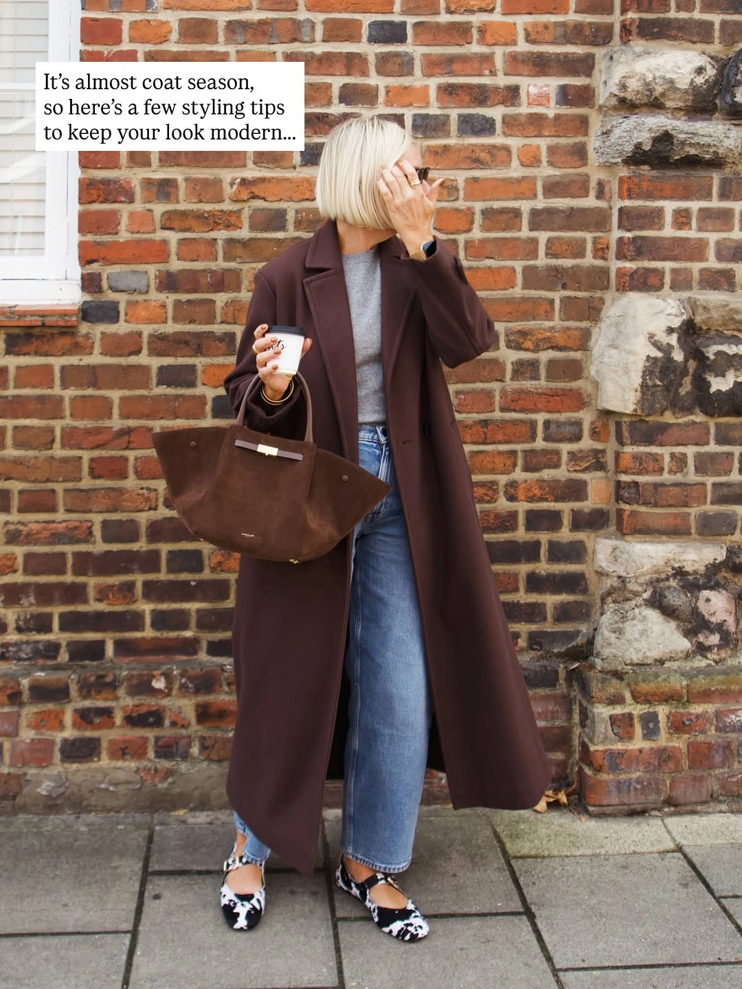 Long chocolate-brown coat with jeans, patterned flats and large bag