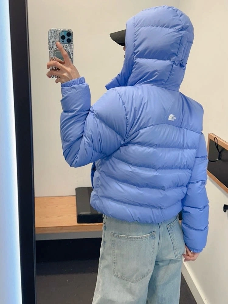 Periwinkle cropped hooded puffer with light wash jeans