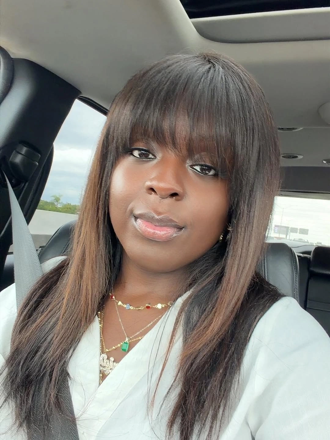 Long smooth brown hair with full bangs and lighter face pieces