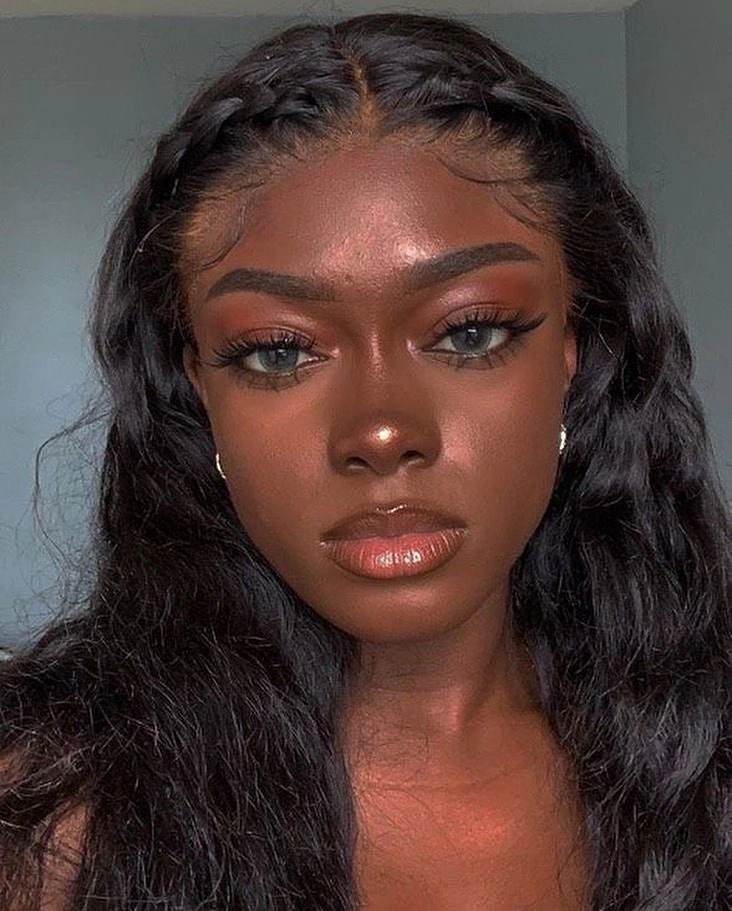 Front braids with long dark waves and styled edges