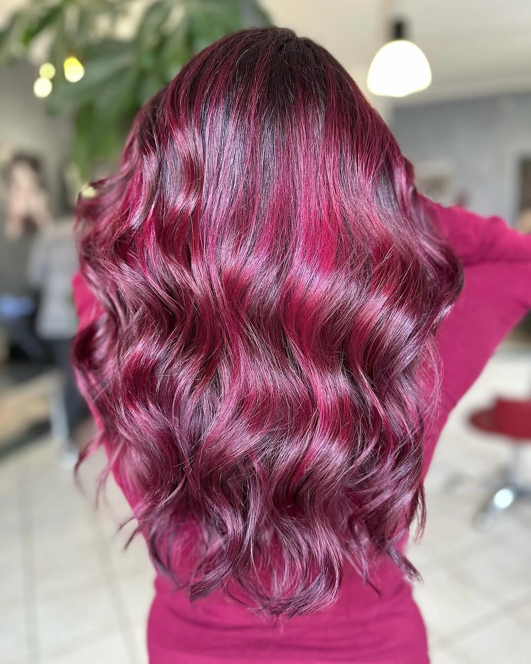 Long magenta wavy hair with glossy broad bends