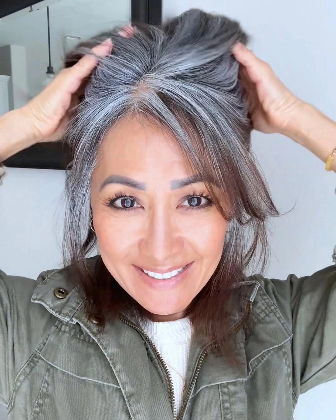 Medium gray and dark hair with lifted top