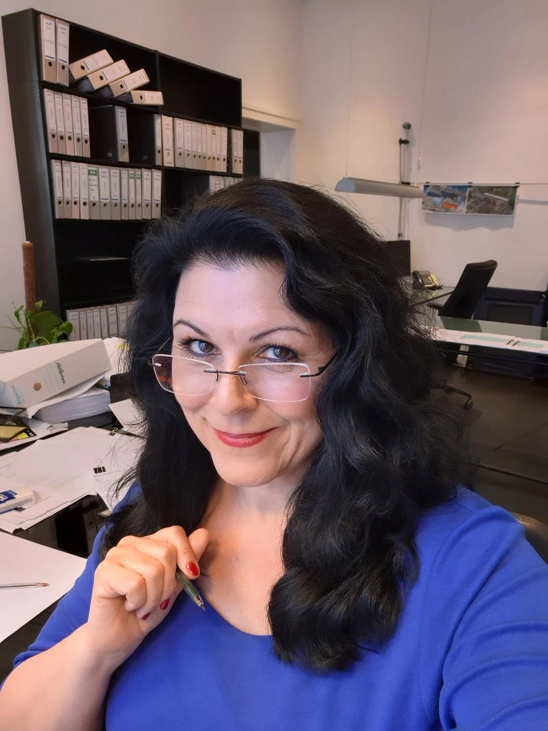 Long dark wavy hair with side part and glasses