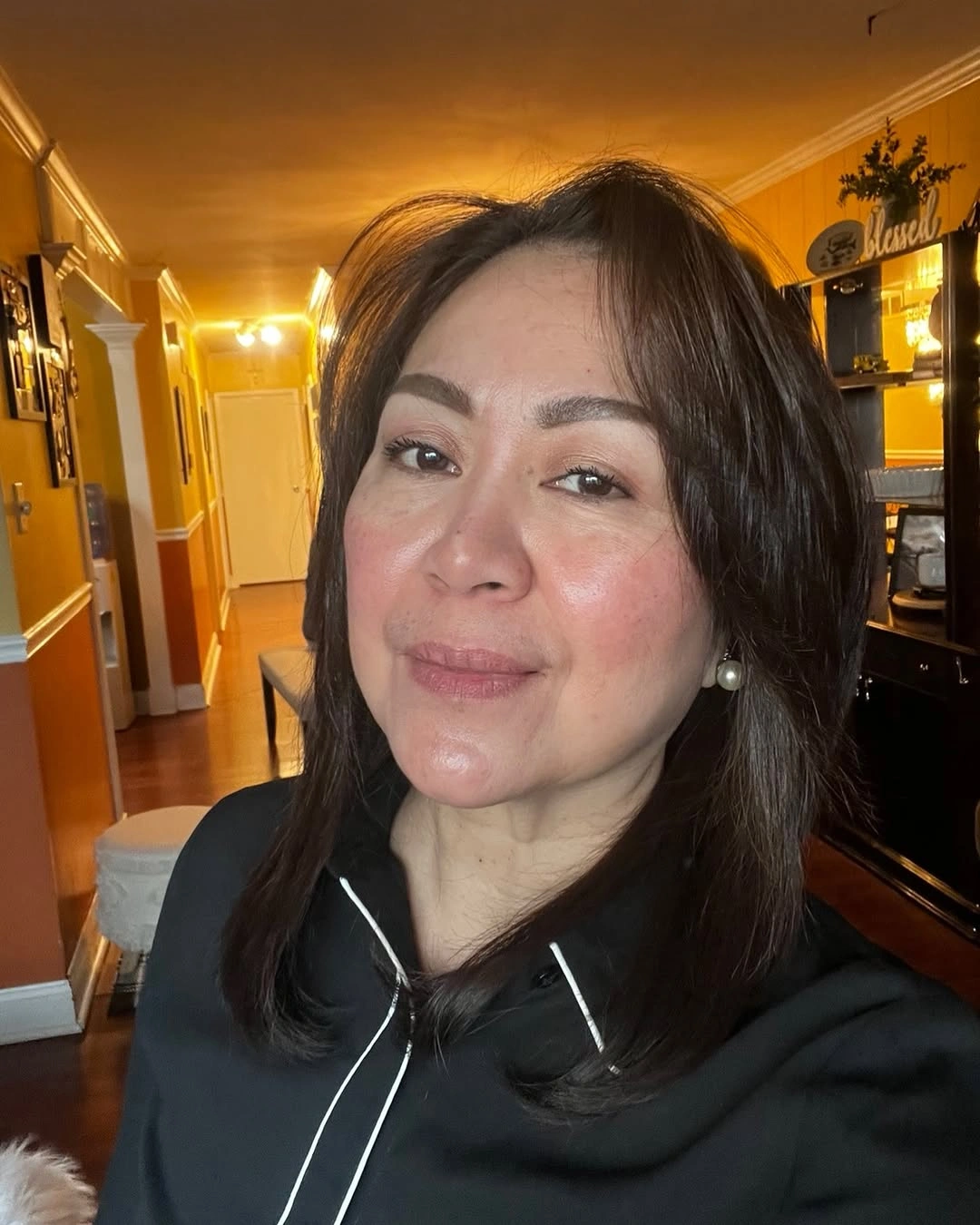 Medium dark shoulder length hair with softly turned ends