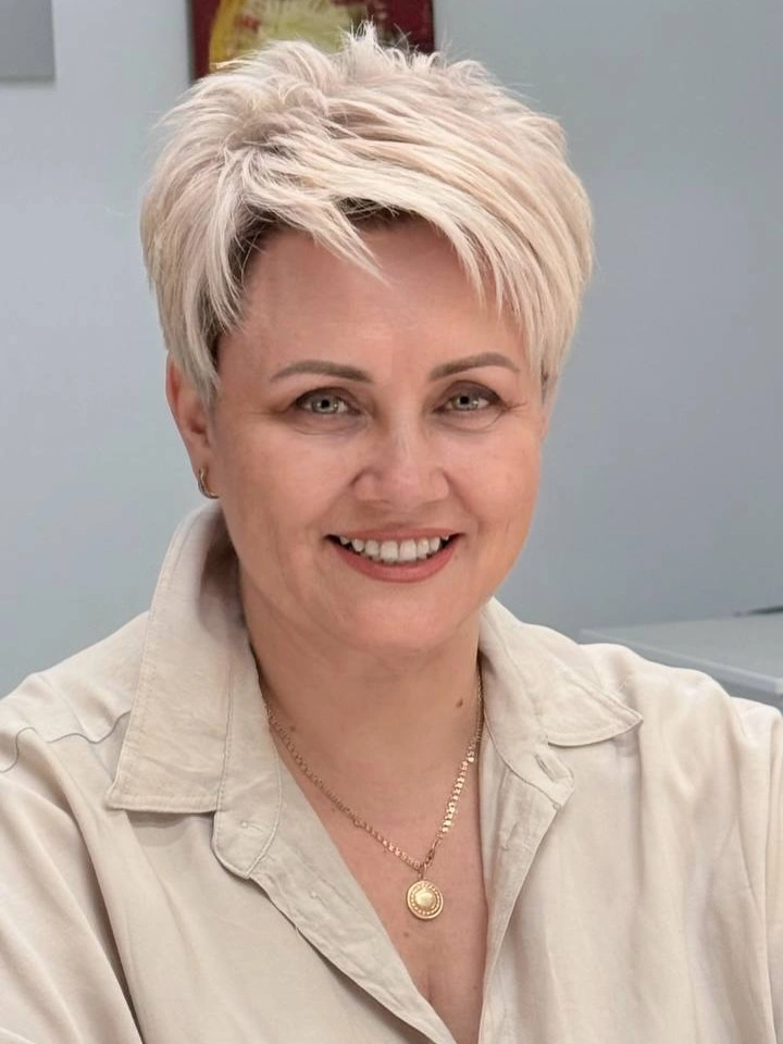 Short blonde pixie with longer diagonal fringe