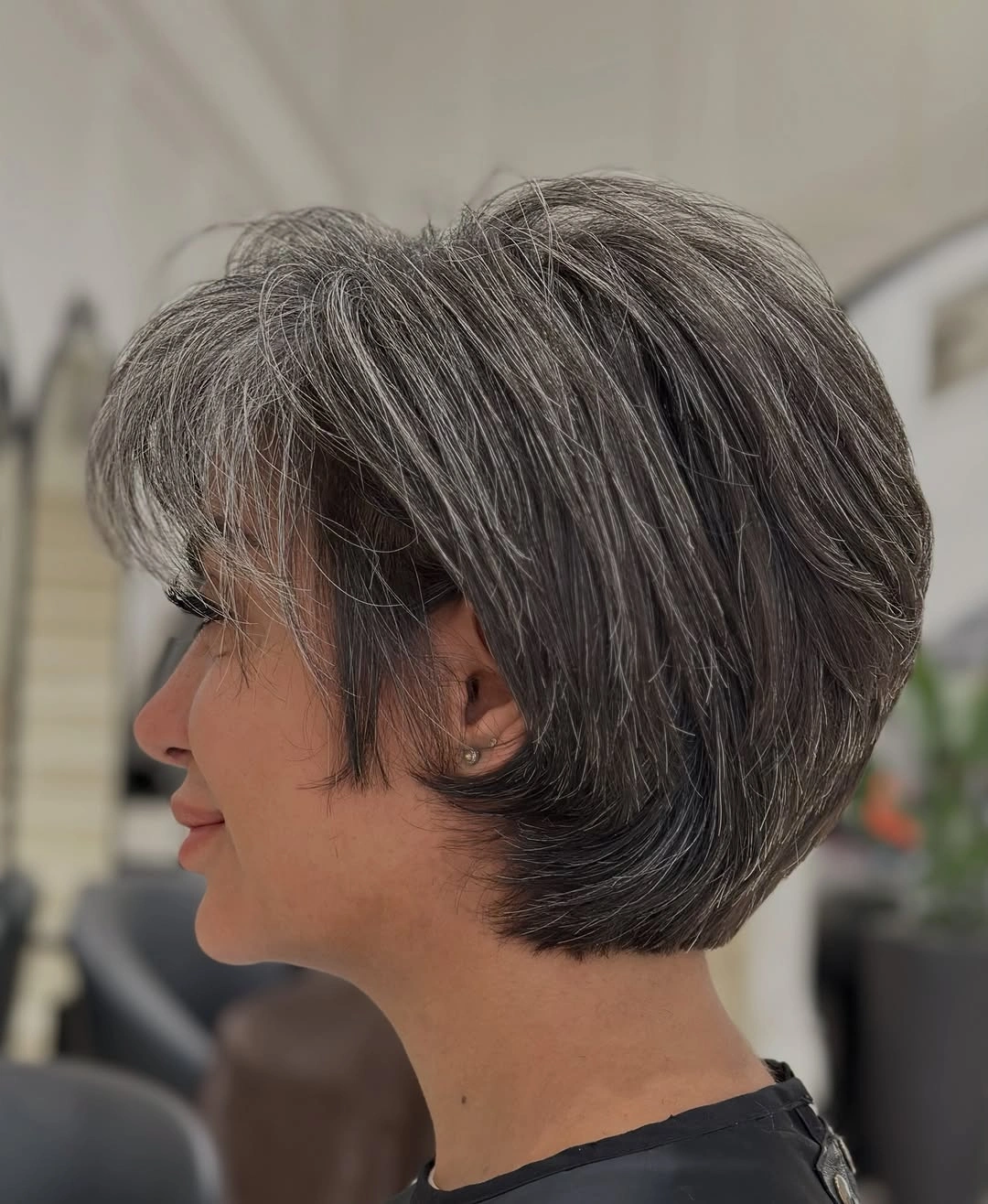 Short gray rounded profile cut with tucked nape