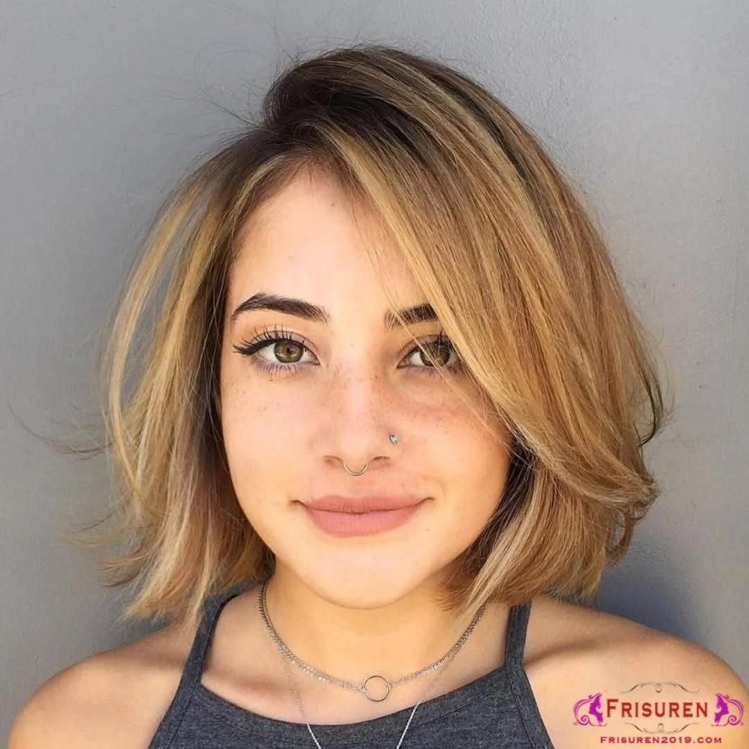 Short blonde side-swept hair with softly flipped ends