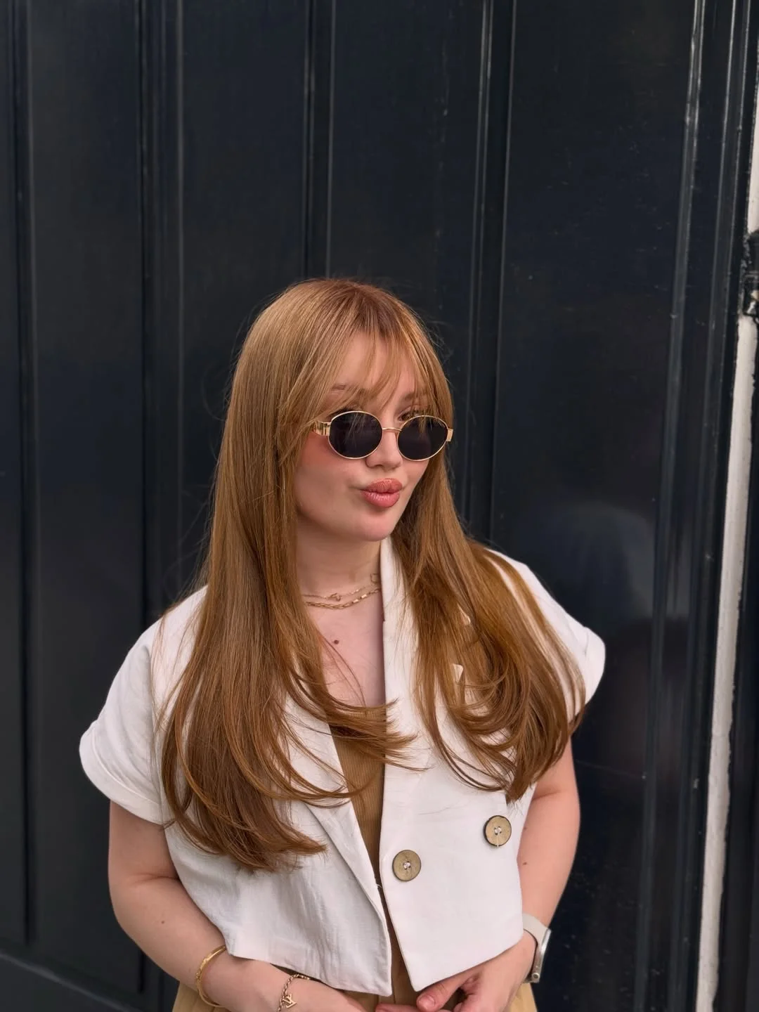 Long copper blonde hair with soft fringe and rounded ends