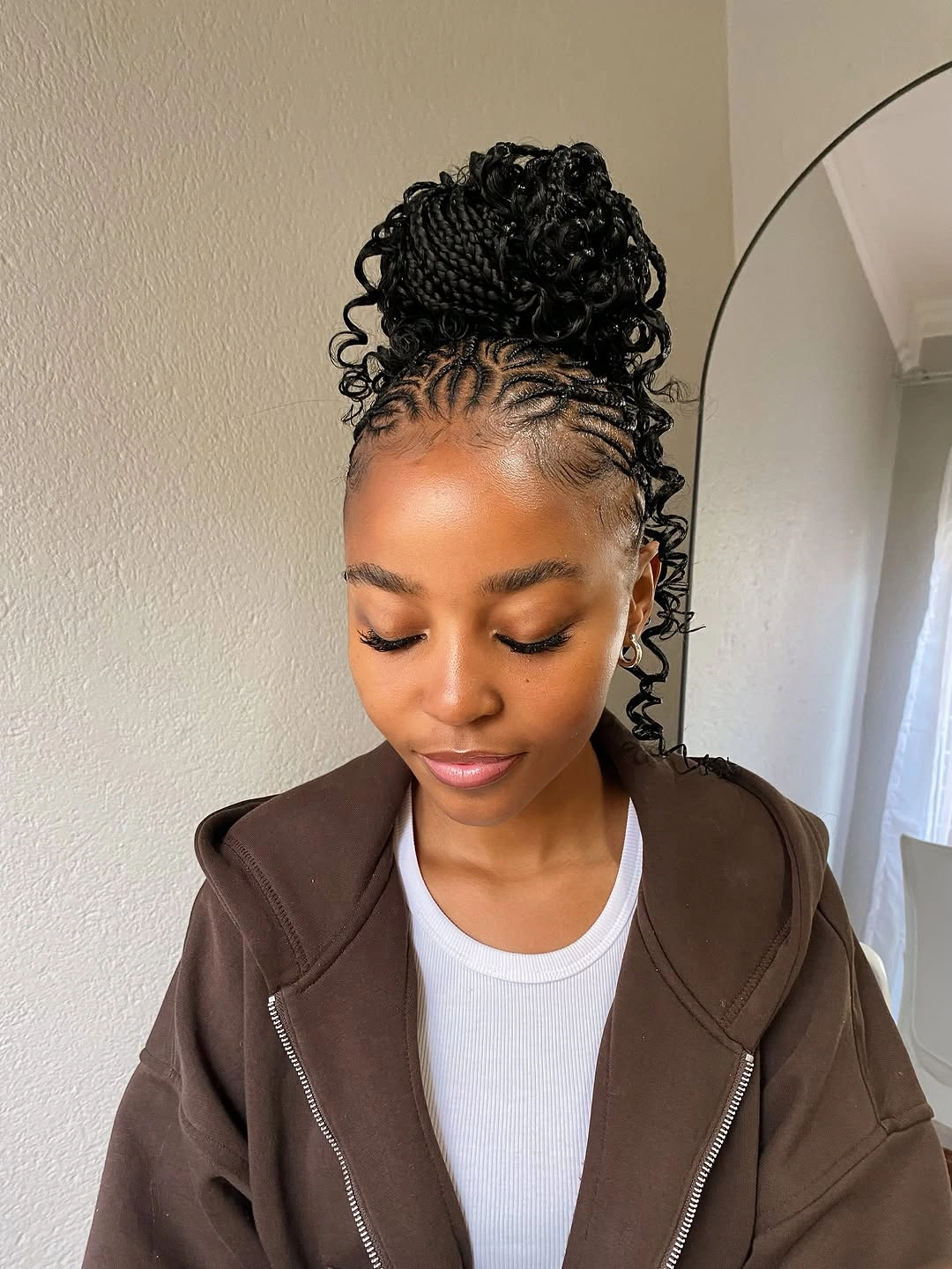 Scalp braids gathered high with curled side detail