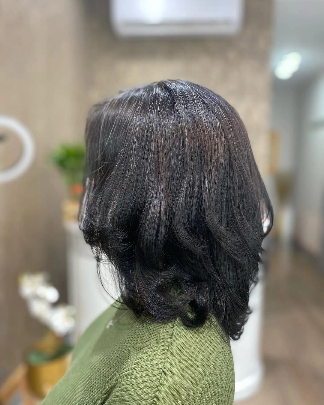 Medium dark hair with rounded volume and turned ends