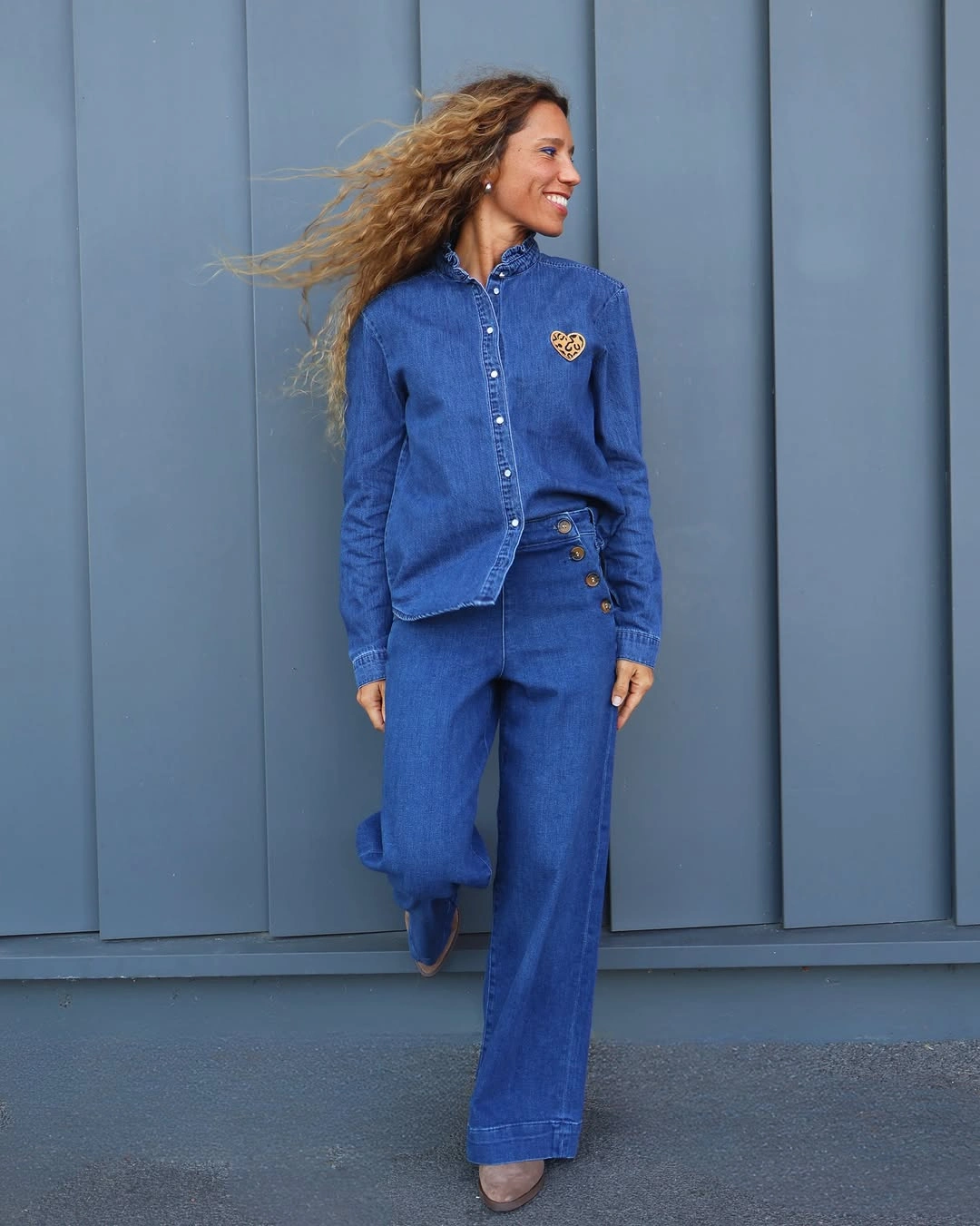Blue denim shirt with matching wide jeans and muted shoes