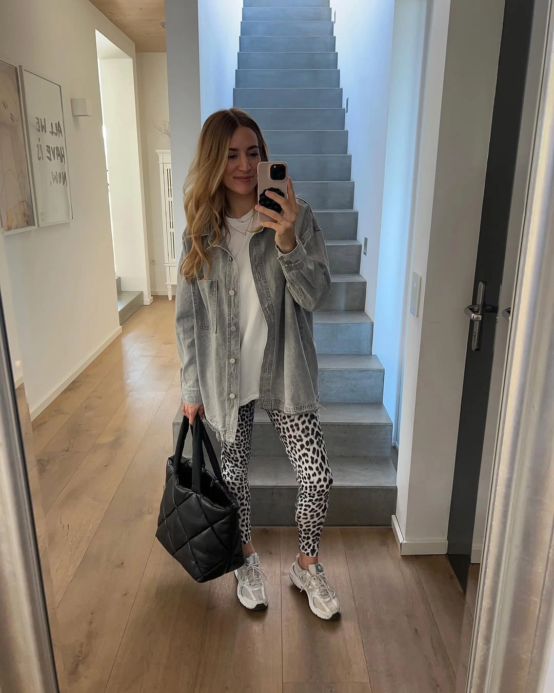 Gray jacket over white top with spotted leggings and sneakers