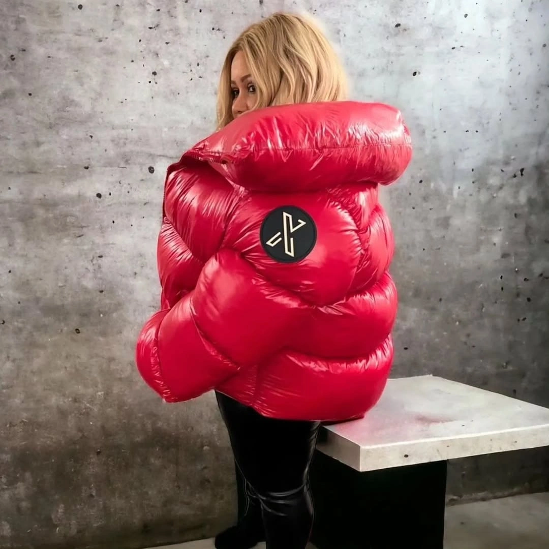 Glossy red oversized puffer seen from back with black lower outfit