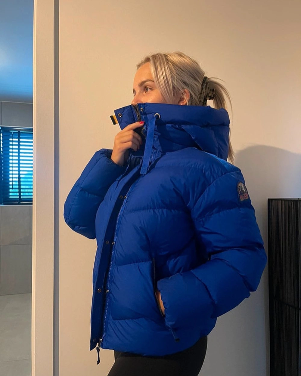 Cobalt cropped puffer with raised collar and black lower layer